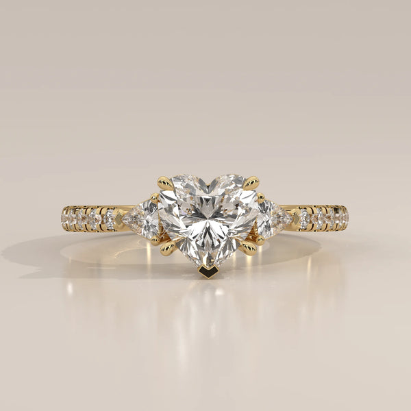 Heart Lab Grown Diamond Three Stone Ring with Trillion Sides in yellow gold, photographed head-on.