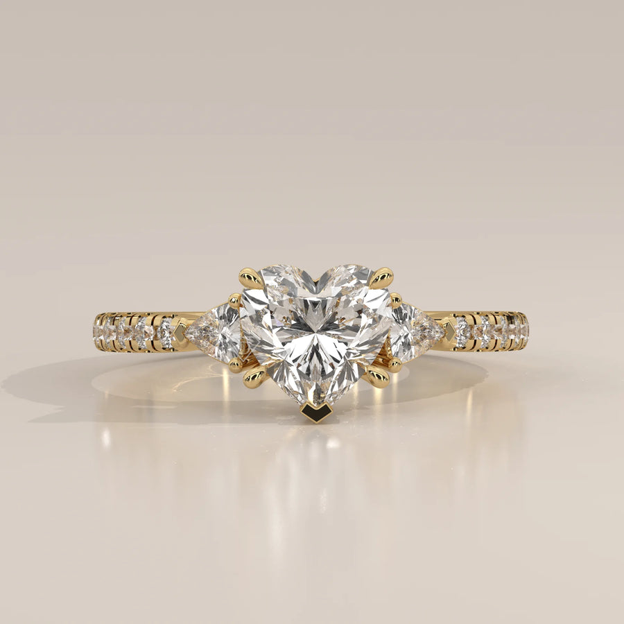 Heart Lab Grown Diamond Three Stone Ring with Trillion Sides in yellow gold, photographed head-on.