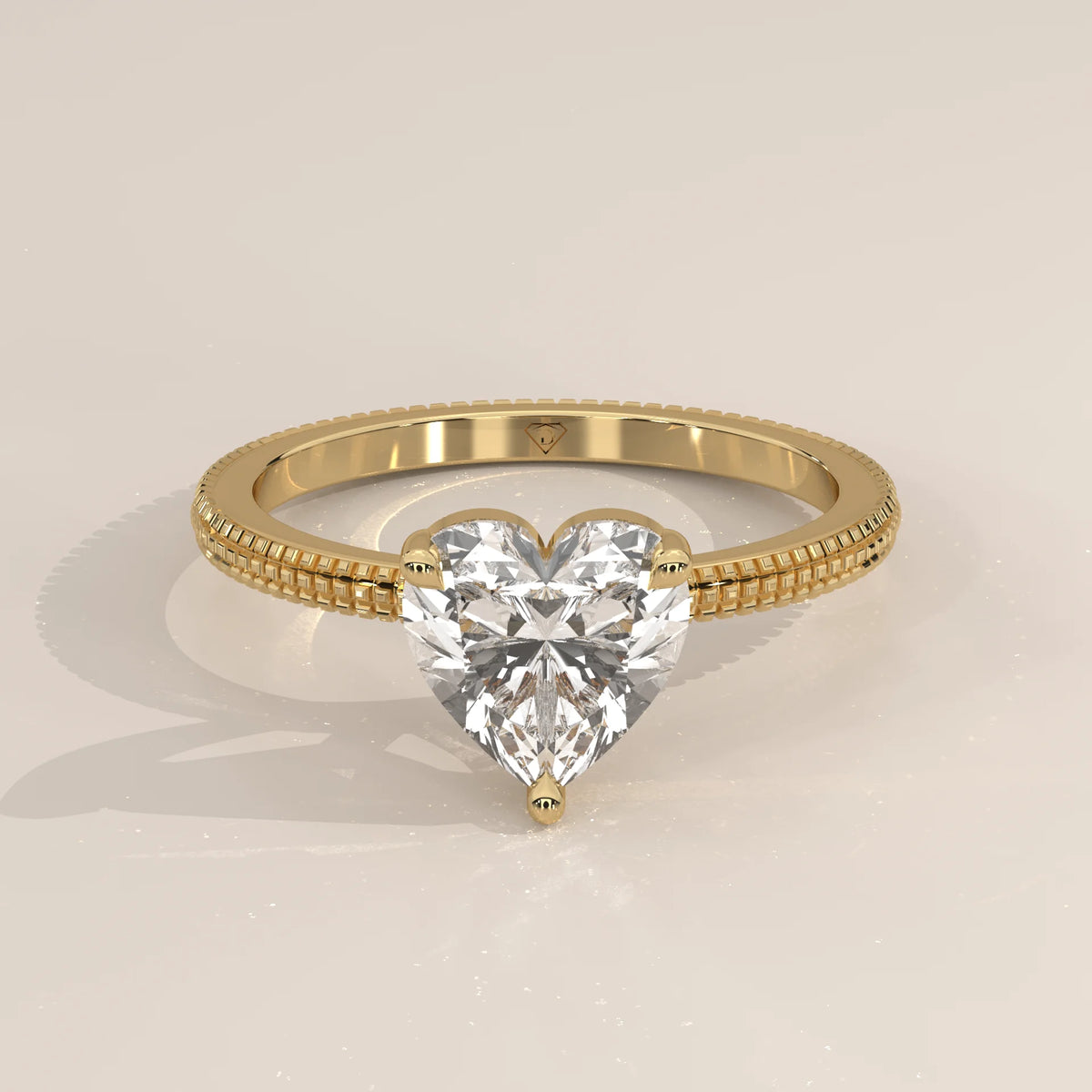 A 14k yellow gold ring with a prominent heart-shaped diamond.