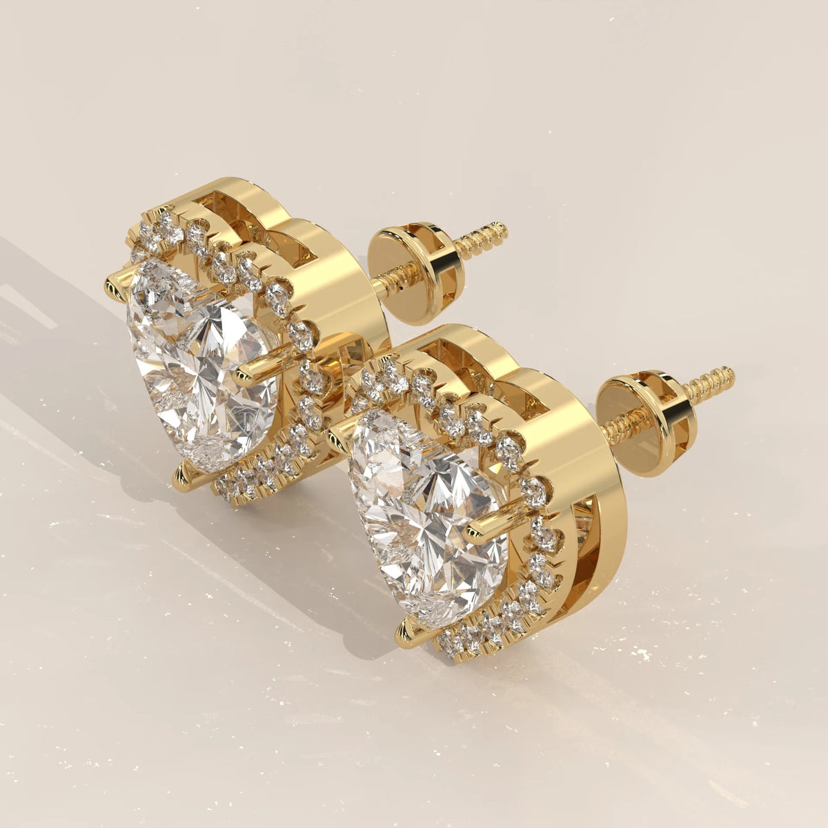 Heart Shape Halo Lab Grown Diamond Stud Earrings with Screw Backs in yellow gold, photographed head-on.