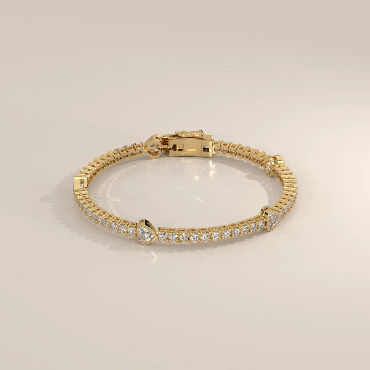 Heart Station Lab Grown Diamond Tennis Bracelet with Round Line in yellow gold, shown at an angle.