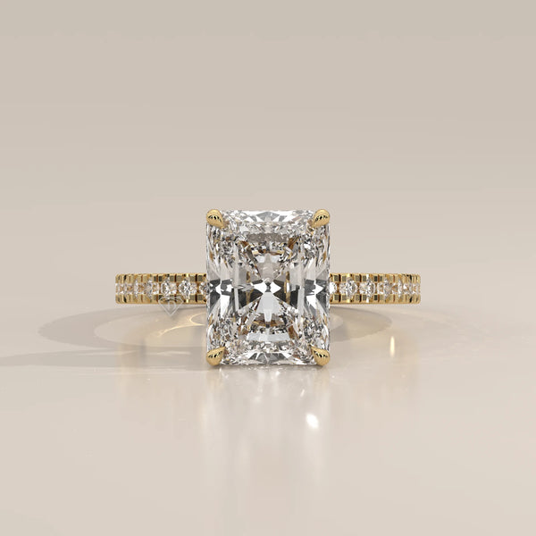 Ivory 5 Carat Radiant Lab Grown Diamond Ring, Hidden Halo Pave Band in yellow gold, photographed head-on.