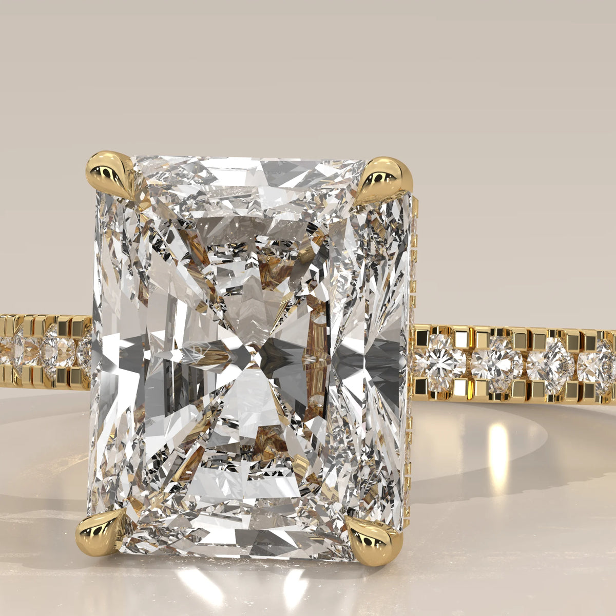 Ivory 5 Carat Radiant Lab Grown Diamond Ring, Hidden Halo Pave Band in yellow gold, front view on a plain background.
