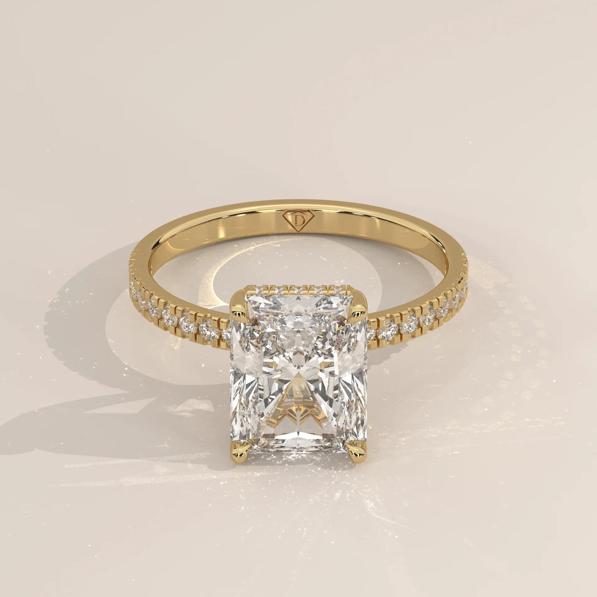 Ivory 5 Carat Radiant Lab Grown Diamond Ring, Hidden Halo Pave Band in yellow gold, shown from the front.
