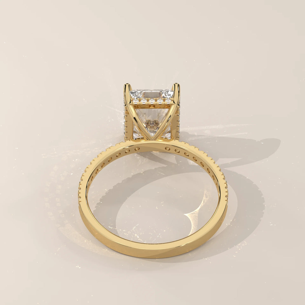 Ivory 5 Carat Radiant Lab Grown Diamond Ring, Hidden Halo Pave Band in yellow gold, side profile view.