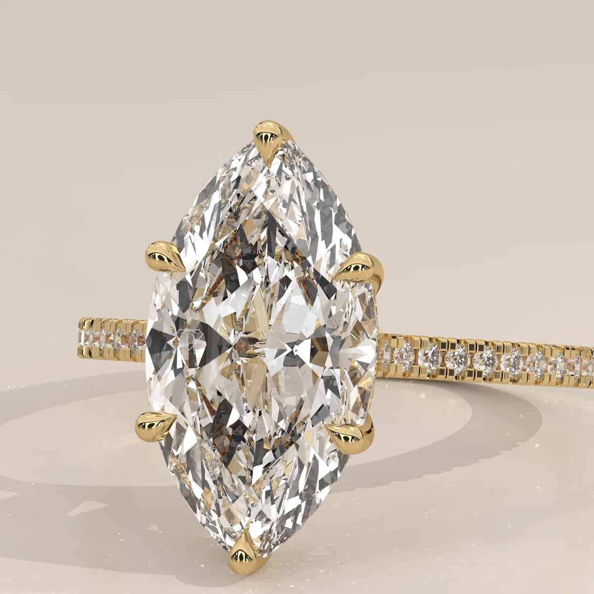 Kalesya 5 Carat Marquise Lab Grown Diamond Ring, Hidden Halo Pave in yellow gold, photographed at a three-quarter angle.