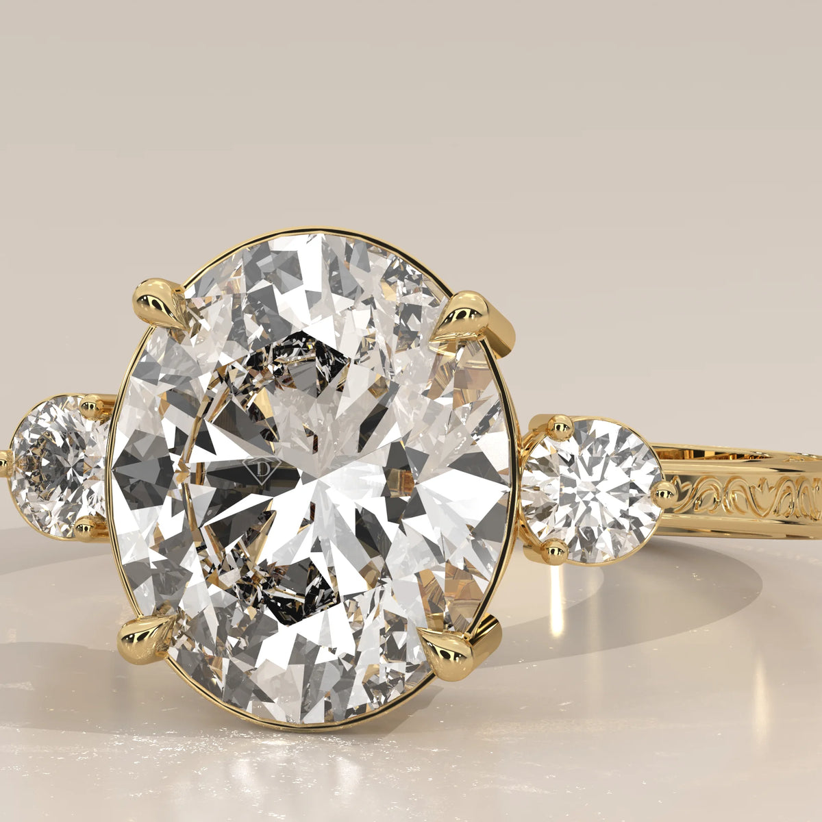 Karly 5 Carat Oval Lab Grown Diamond Three Stone Ring, Engraved Band in yellow gold, shown on a plain background.