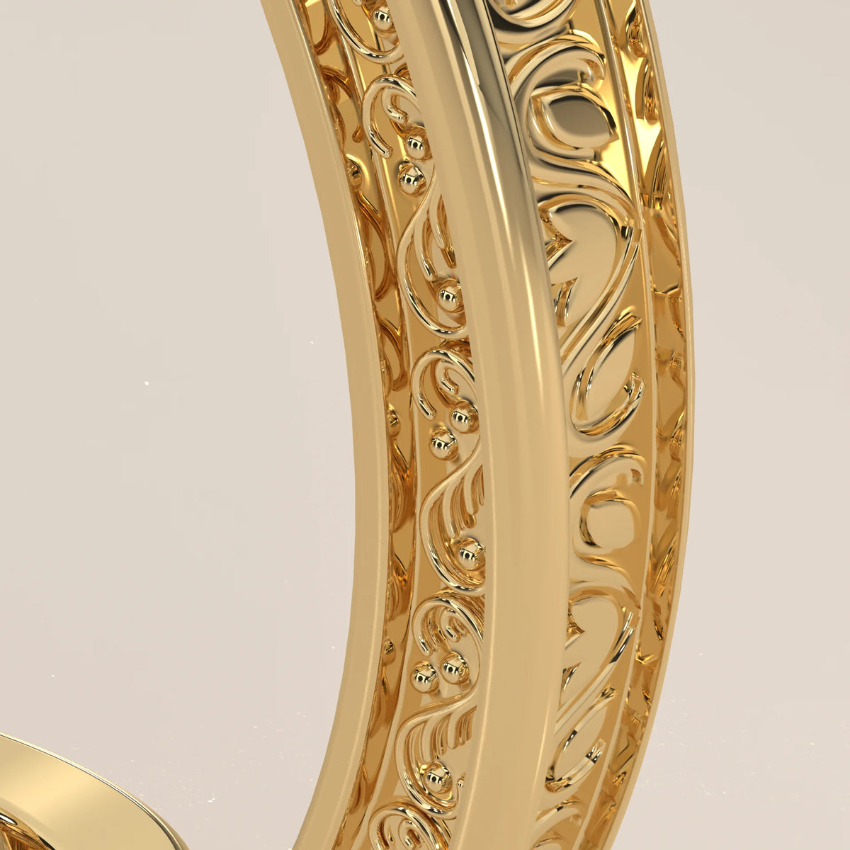Karly 5 Carat Oval Lab Grown Diamond Three Stone Ring, Engraved Band in yellow gold, studio photograph on a plain background.