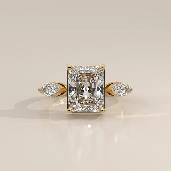 Krace 5 Carat Radiant Lab Grown Diamond Ring, Marquise Three Stone in yellow gold, photographed head-on.