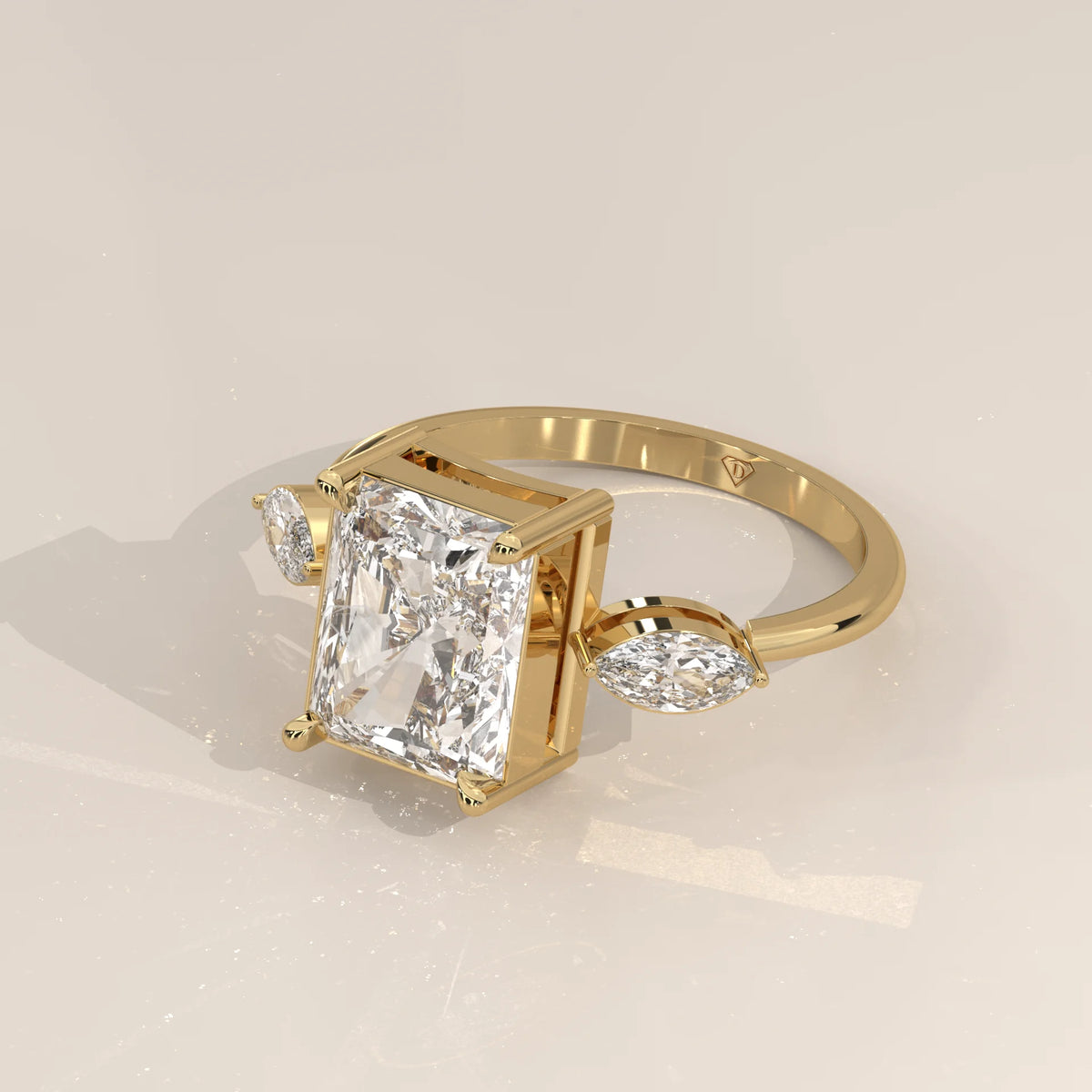 Krace 5 Carat Radiant Lab Grown Diamond Ring, Marquise Three Stone in yellow gold, shown from the side.