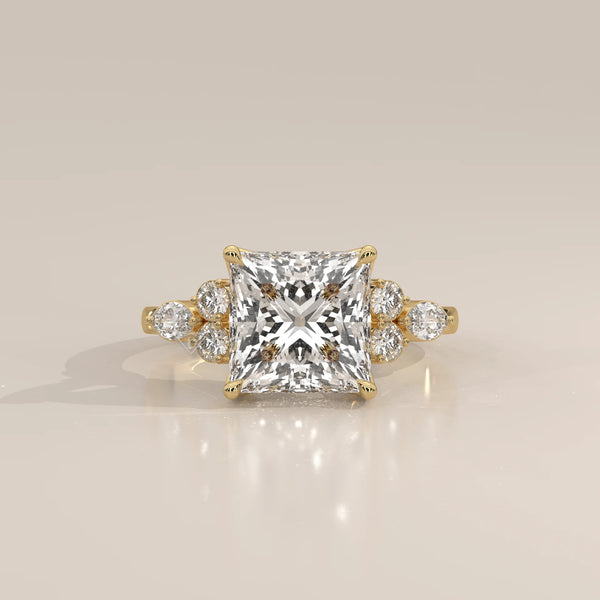 Layrana 5 Carat Princess Lab Grown Diamond Ring, Diamond Clusters in yellow gold, photographed head-on.