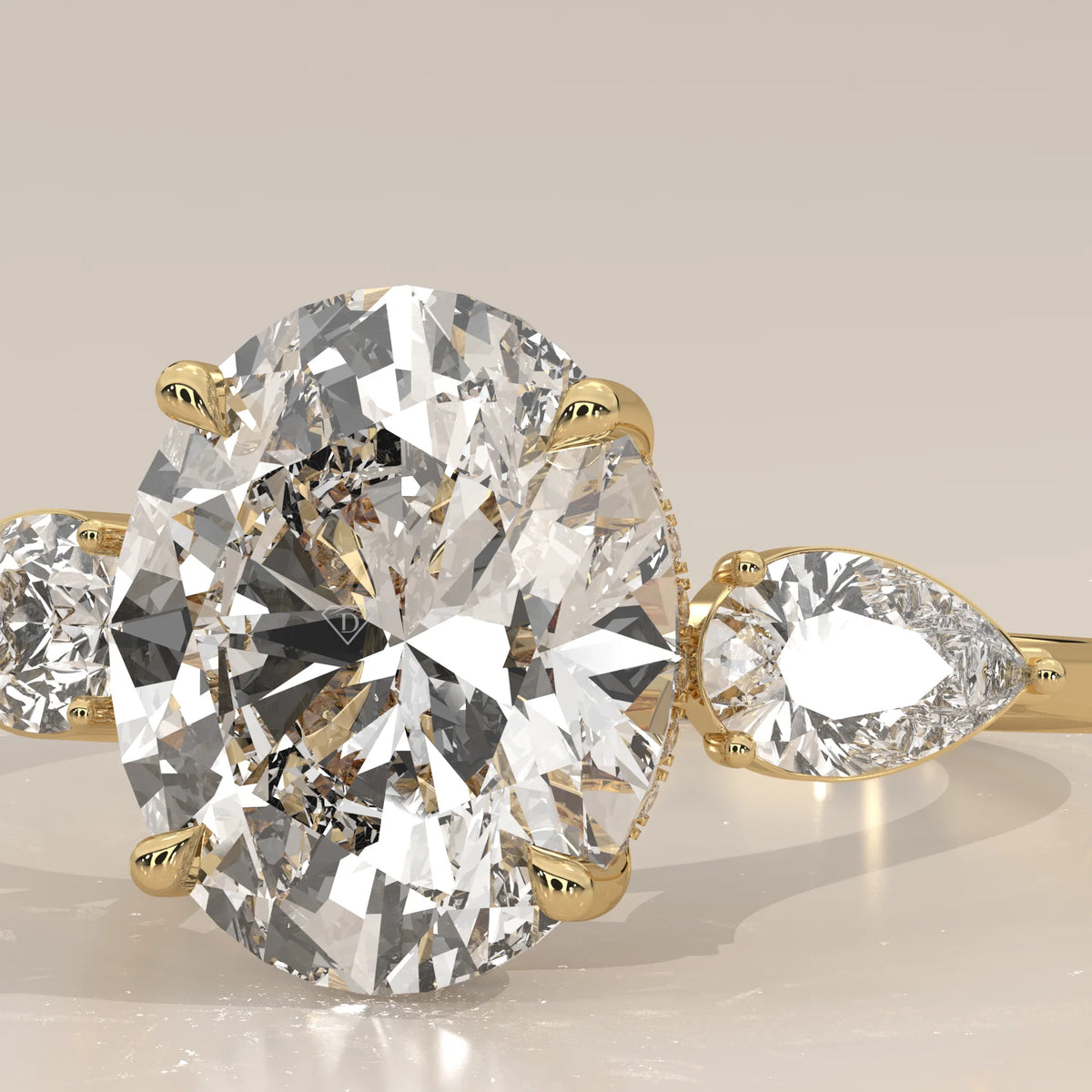 Lerrayki 5 Carat Oval Lab Grown Diamond Three Stone Ring, Pear Sides in yellow gold, front view on a plain background.