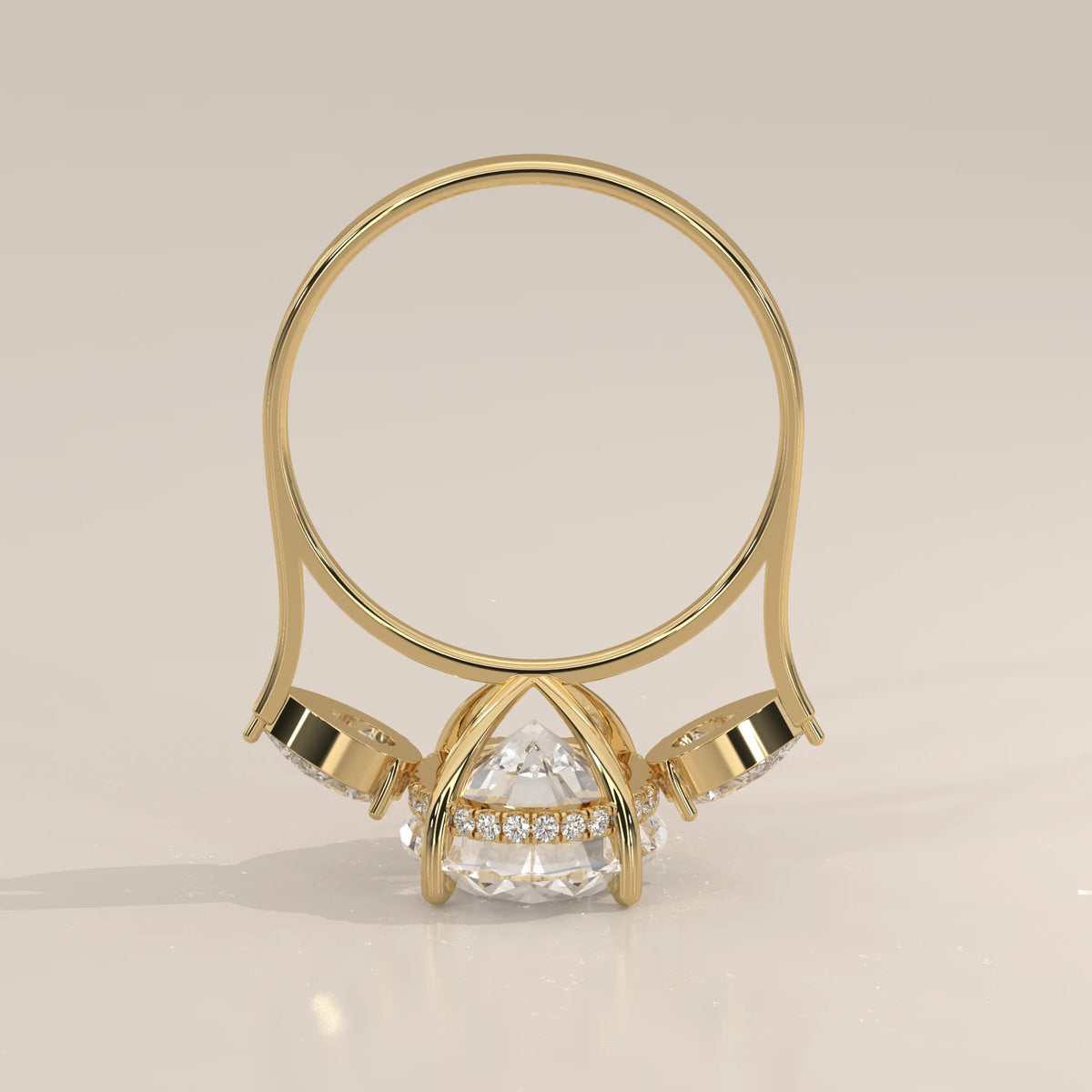 Lerrayki 5 Carat Oval Lab Grown Diamond Three Stone Ring, Pear Sides in yellow gold, shown from the side.