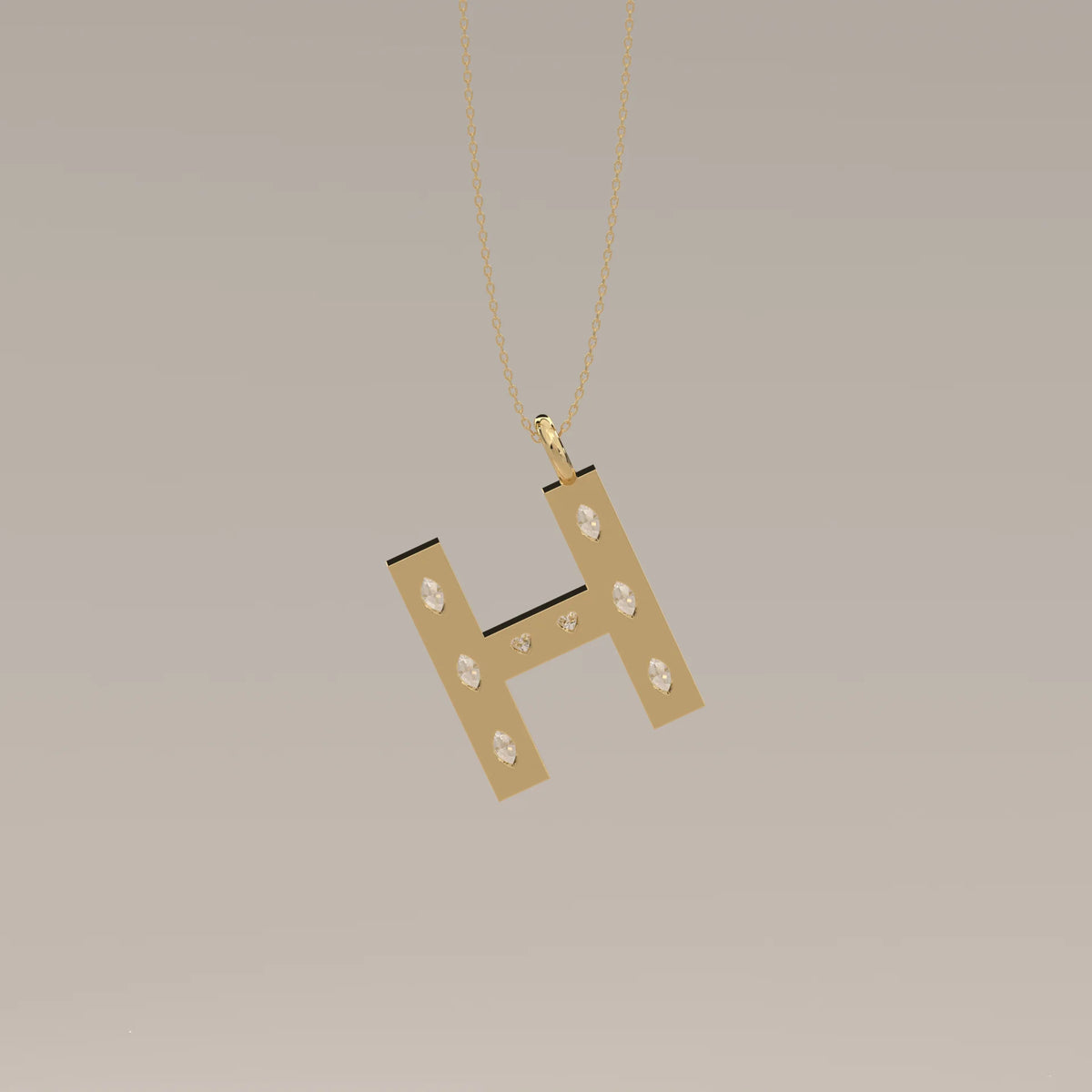 Letter H Initial Pendant with Marquise Lab Grown Diamonds in yellow gold, shown at an angle.
