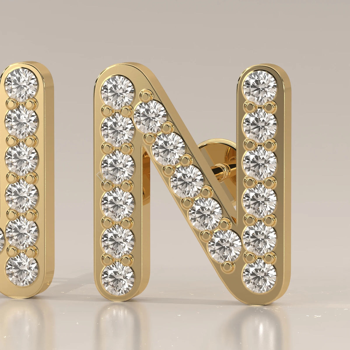 Letter N Initial Pave Lab Grown Diamond Stud Earrings in yellow gold, front view on a plain background.