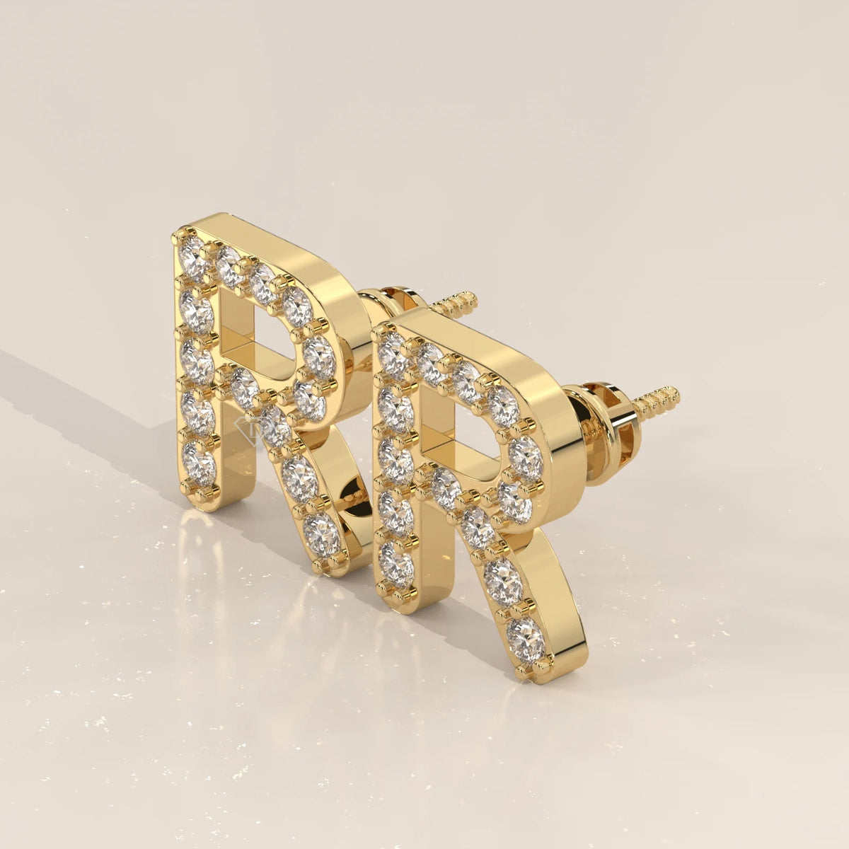 Letter R Initial Pave Lab Grown Diamond Stud Earrings in yellow gold, shown at an angle.