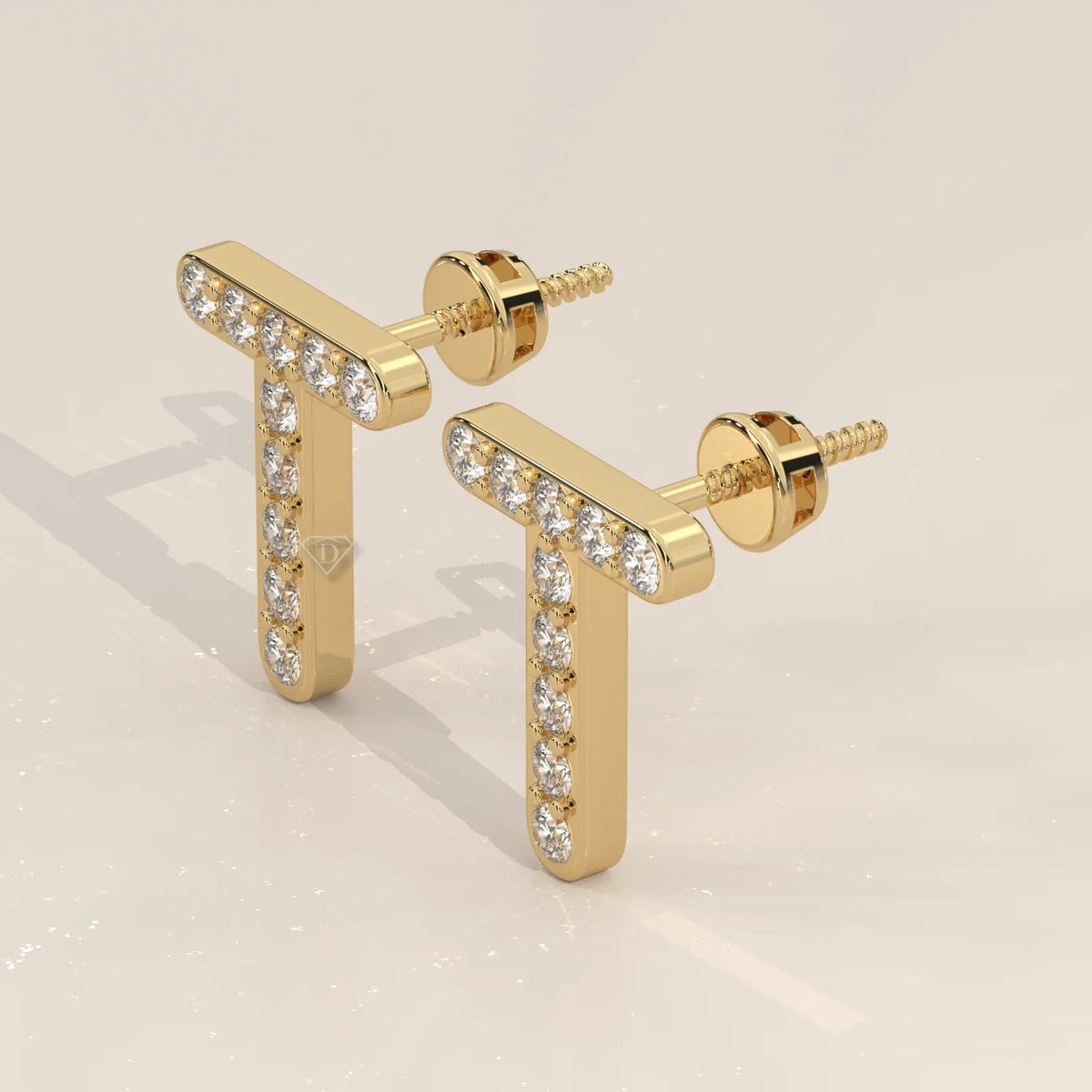 Letter T Initial Pave Lab Grown Diamond Stud Earrings in yellow gold, shown at an angle.