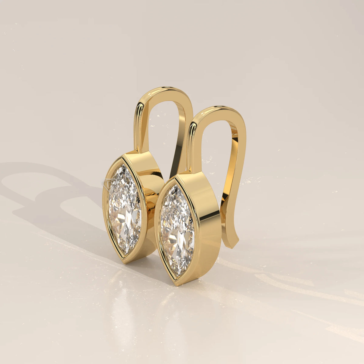 Marquise Bezel Lab Grown Diamond Drop Earrings on a Gold Hook in yellow gold, shown from the side.
