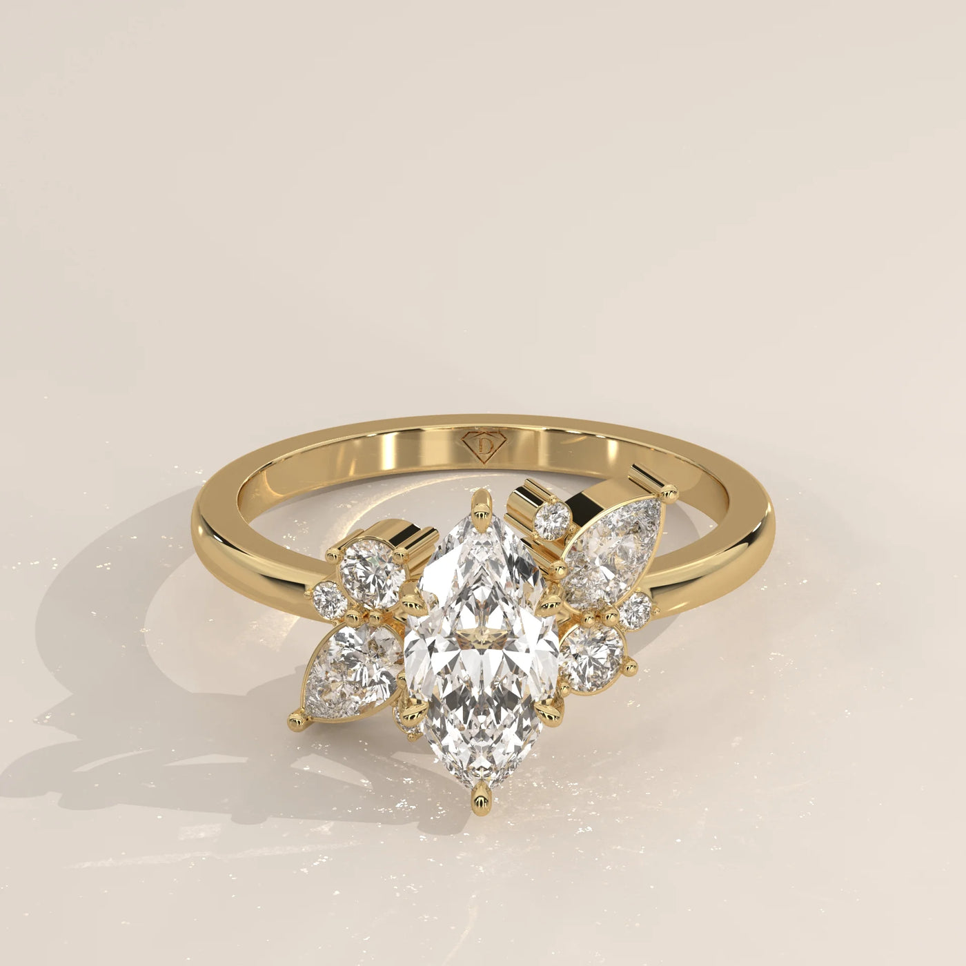 Yellow gold ring with a central marquise diamond surrounded by smaller diamonds.