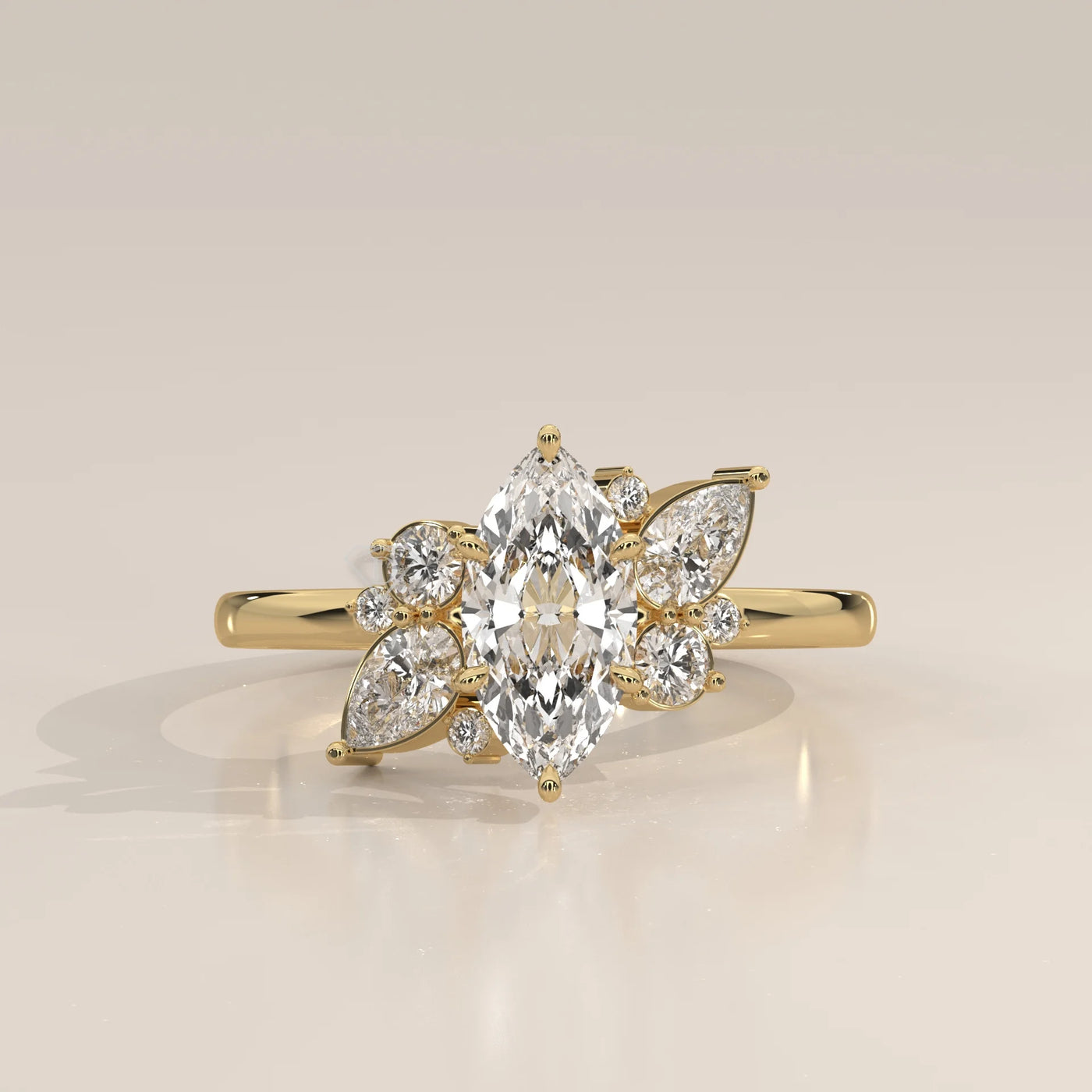 Yellow gold ring with a central marquise diamond surrounded by smaller diamonds.