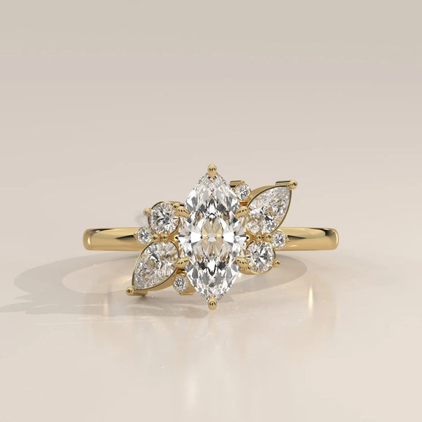 Yellow gold ring with a central marquise diamond surrounded by smaller diamonds.