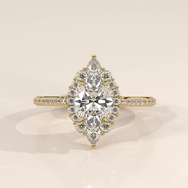 Elegant yellow gold engagement ring featuring a large marquise diamond surrounded by smaller diamonds.
