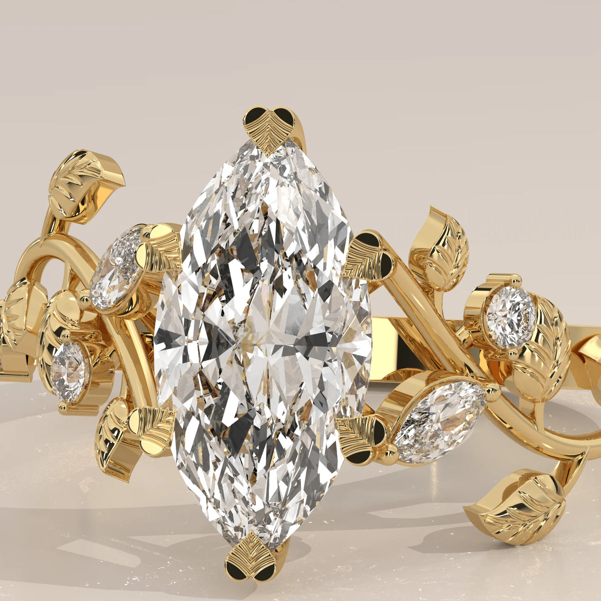 Marquise Lab Grown Diamond Vine Ring with Engraved Leaves in yellow gold, shown in close-up.