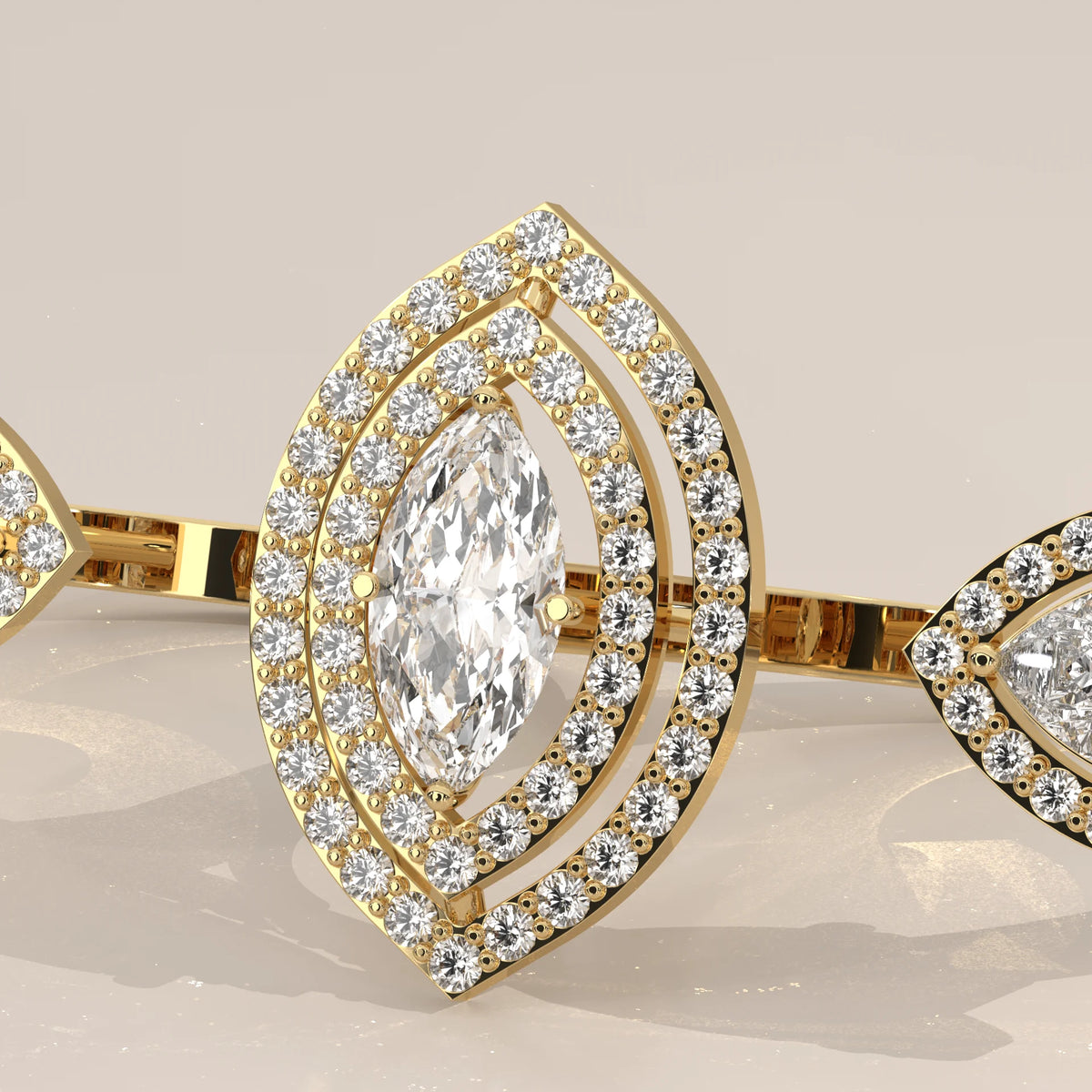 Marquise Lab Grown Diamond Double Halo Two Finger Ring with Pear Ends in yellow gold, studio photograph on a plain background.