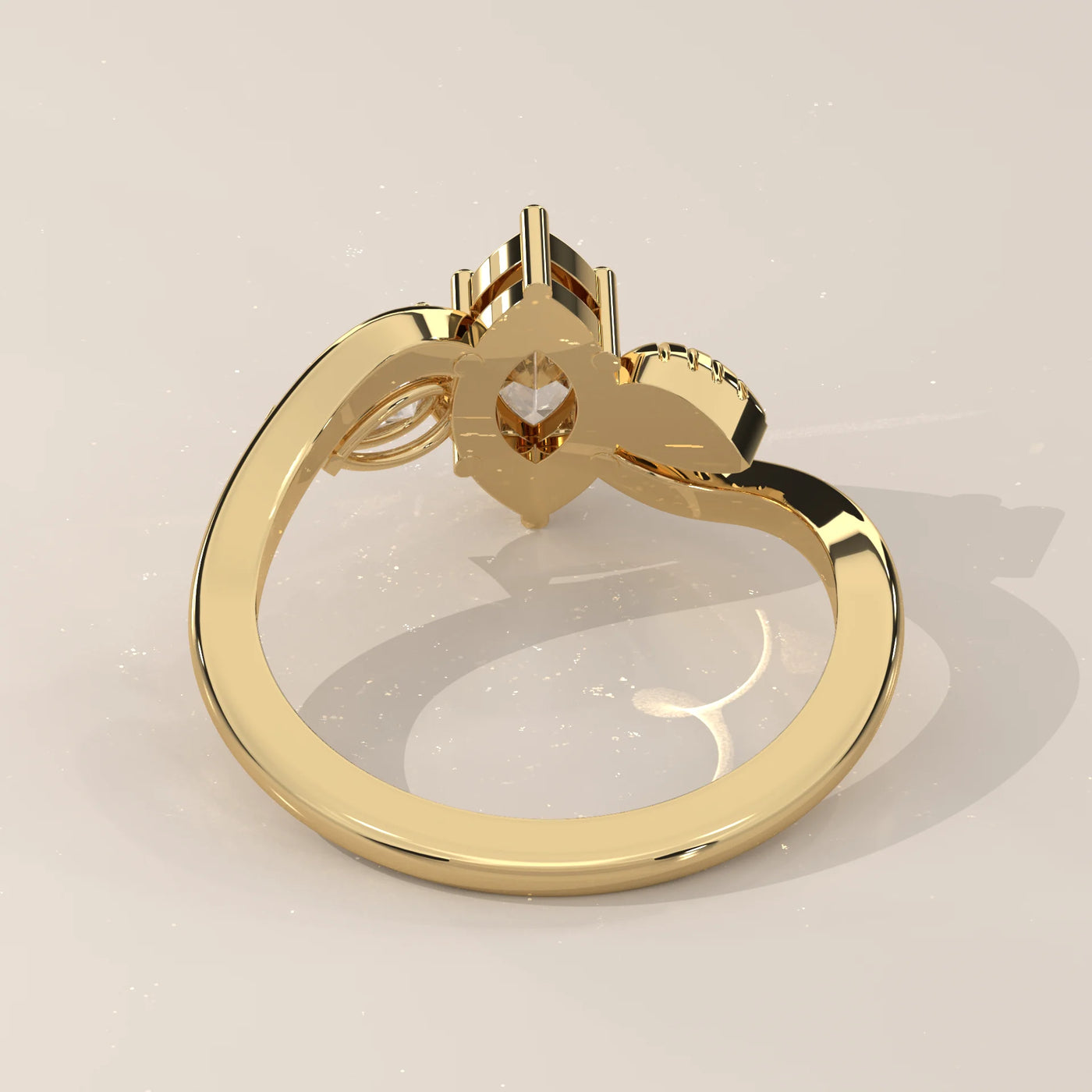 A yellow gold ring with a marquise diamond and accent stones.