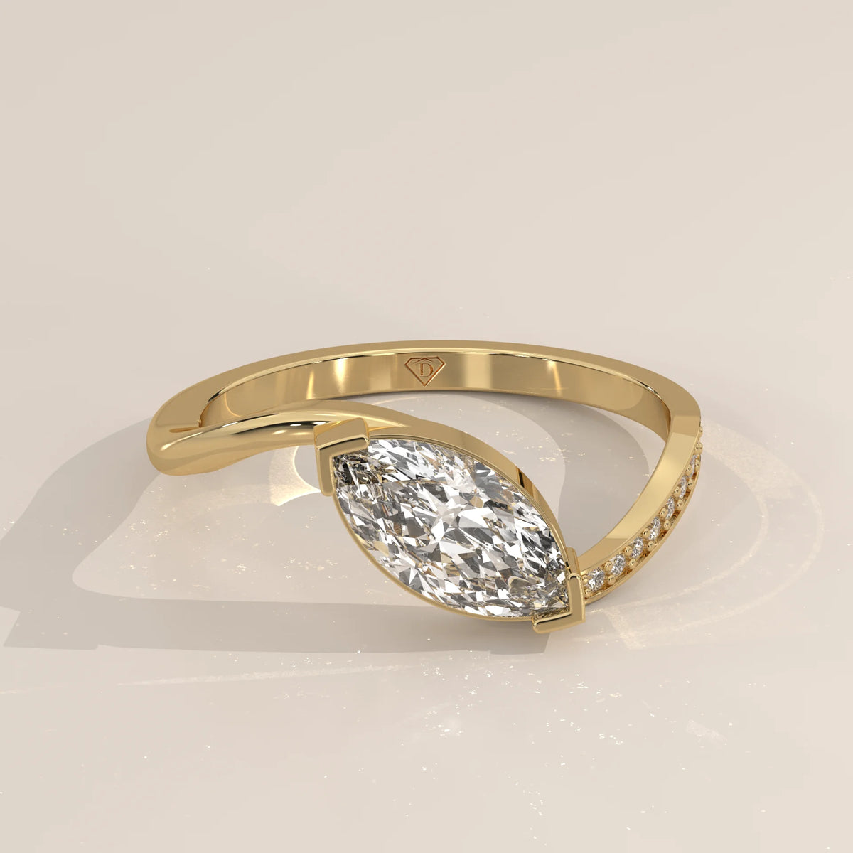 Marquise Lab Grown Diamond East West Half Bezel Bypass Ring in yellow gold, photographed from the side.