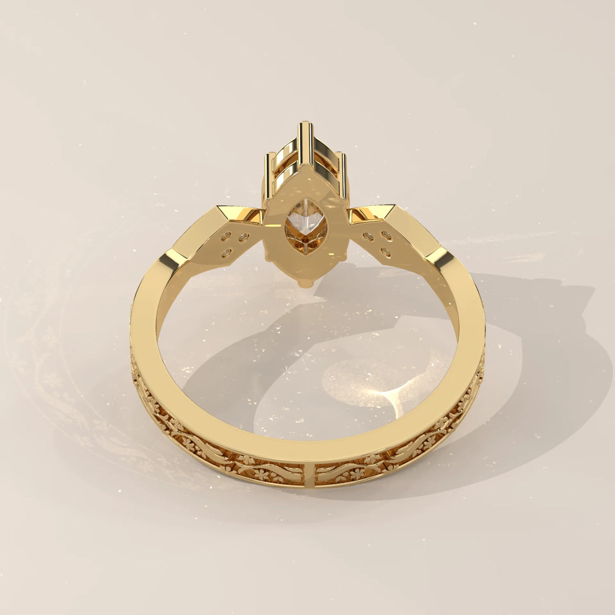 Gold ring with a marquise-cut diamond and ornate band