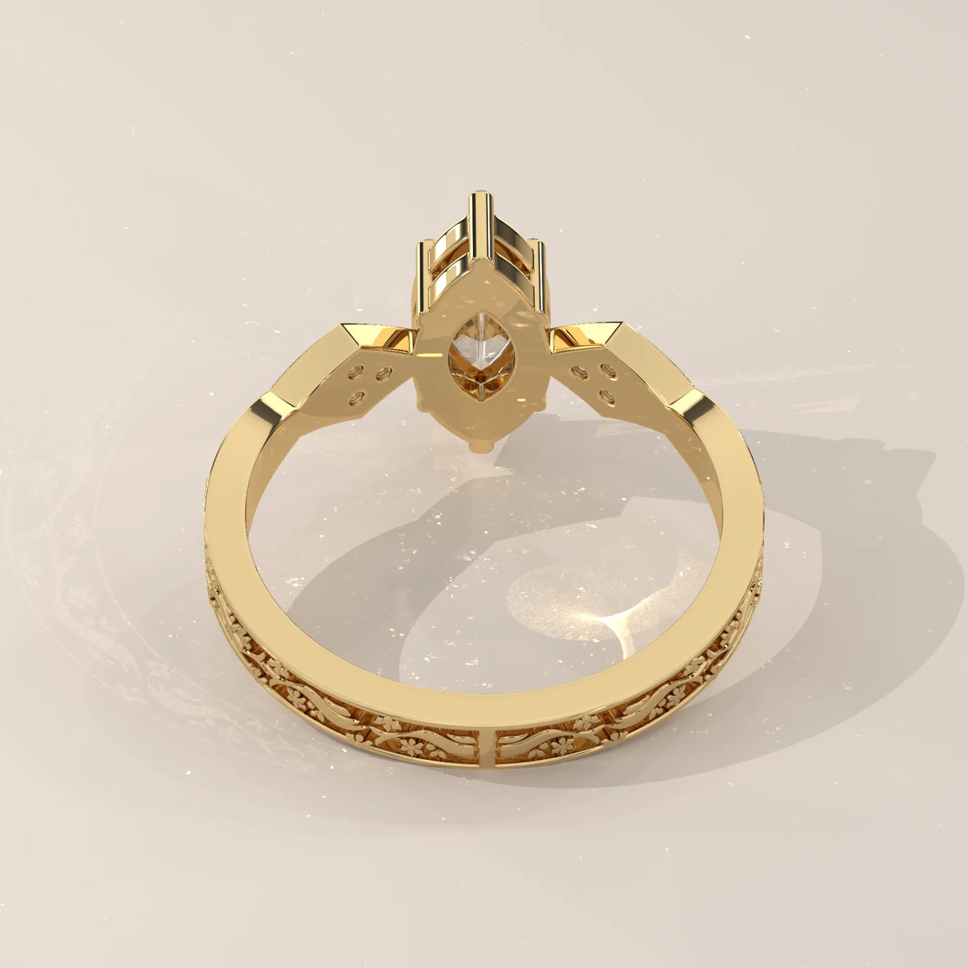 Gold ring with a marquise-cut diamond and ornate band