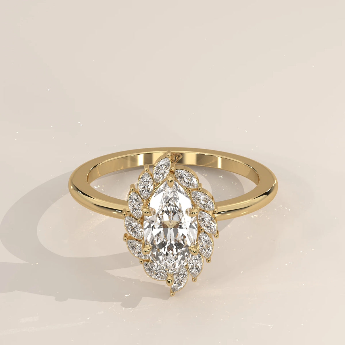 Yellow gold ring featuring a marquise-cut diamond encircled by smaller diamonds.