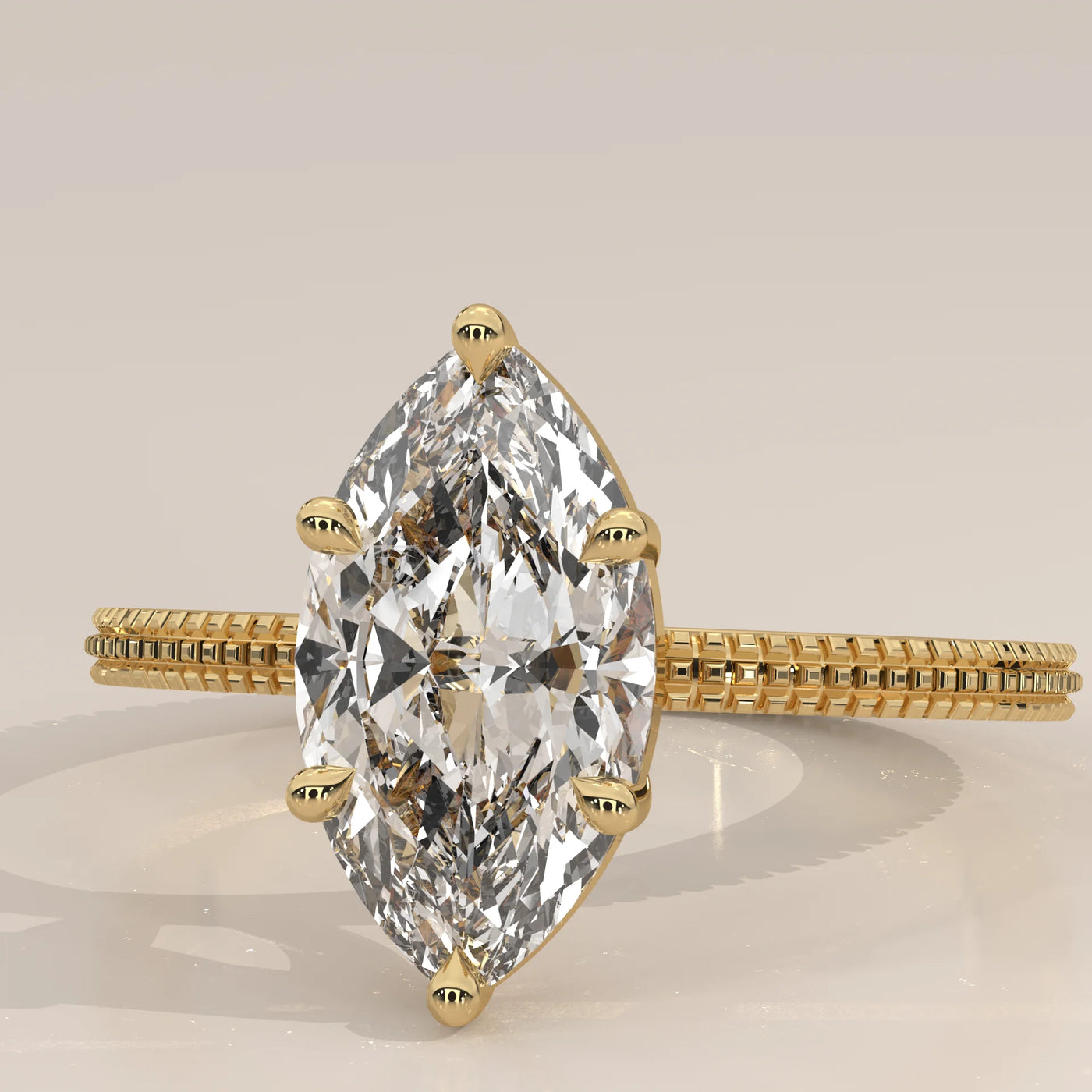 A yellow gold ring with a large marquise-cut diamond.