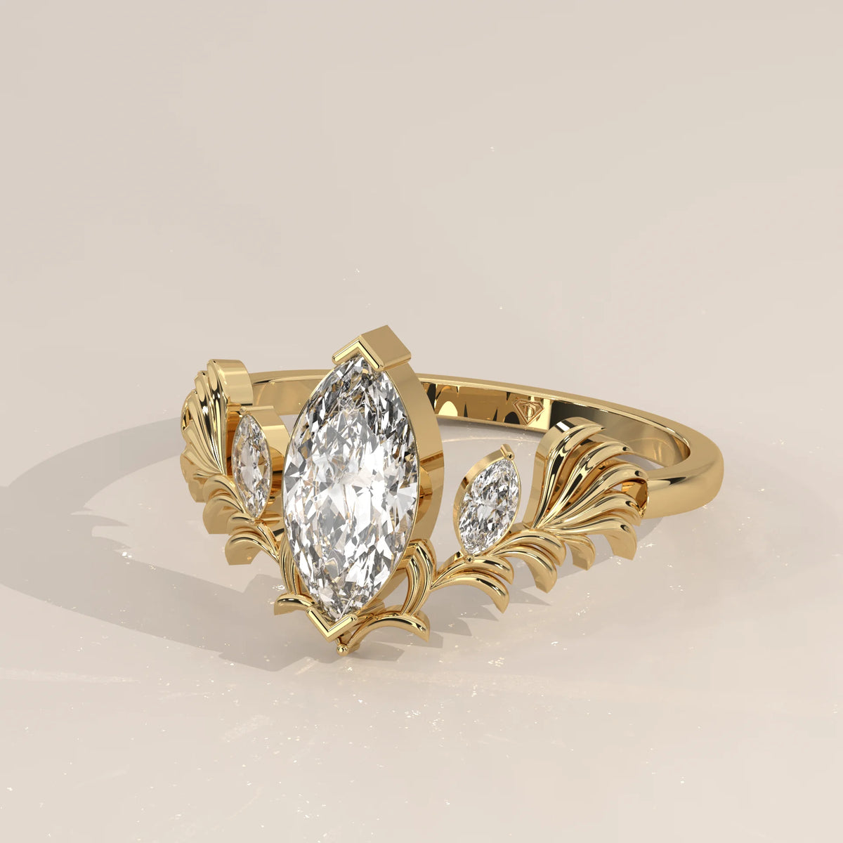 Marquise Lab Grown Diamond Ring with Carved Leaf Wings in yellow gold, front view on a plain background.