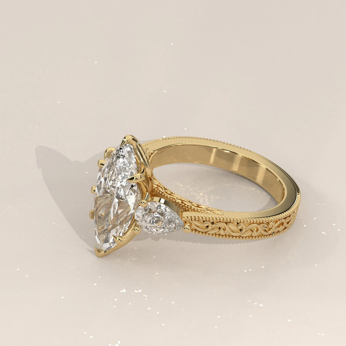 Side view: Marquise Diamond Three Stone Ring with Pear Side Stones and Vintage Engraved Band in 14K Yellow Gold – Lab Grown – Driona Jewels