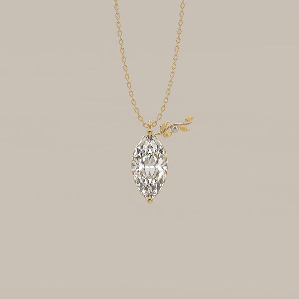 Marquise Lab Grown Diamond Pendant with Leafy Sprig Accent in yellow gold, shown from the front.