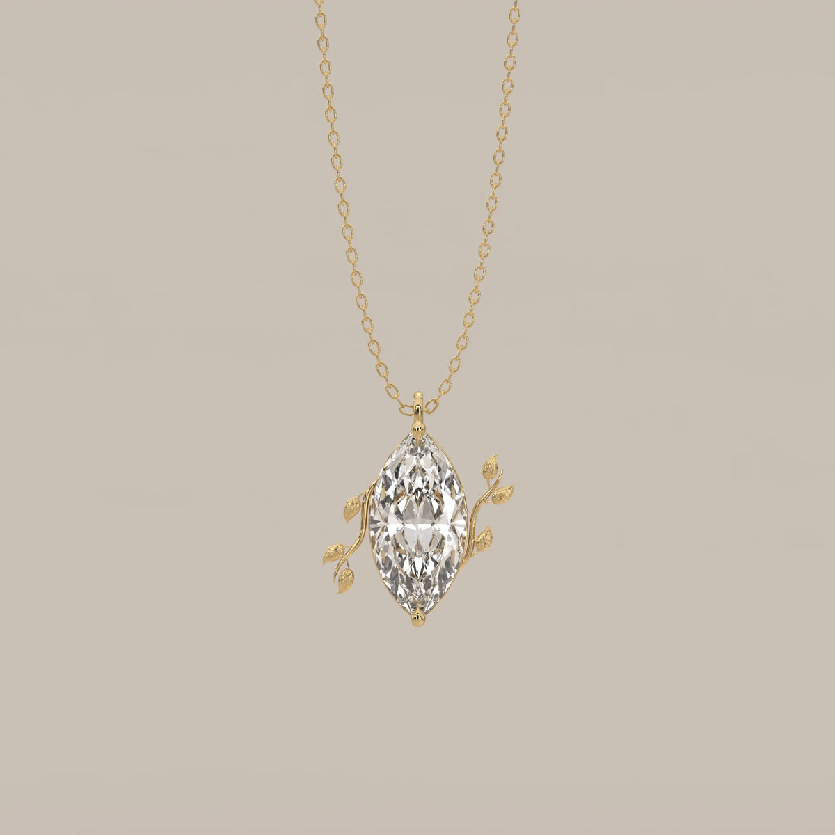 Marquise Lab Grown Diamond Solitaire Pendant with Twin Leaf Vines in yellow gold, shown from the front.