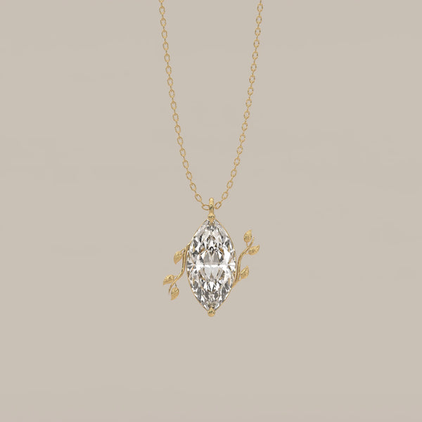 Marquise Lab Grown Diamond Solitaire Pendant with Twin Leaf Vines in yellow gold, shown from the front.