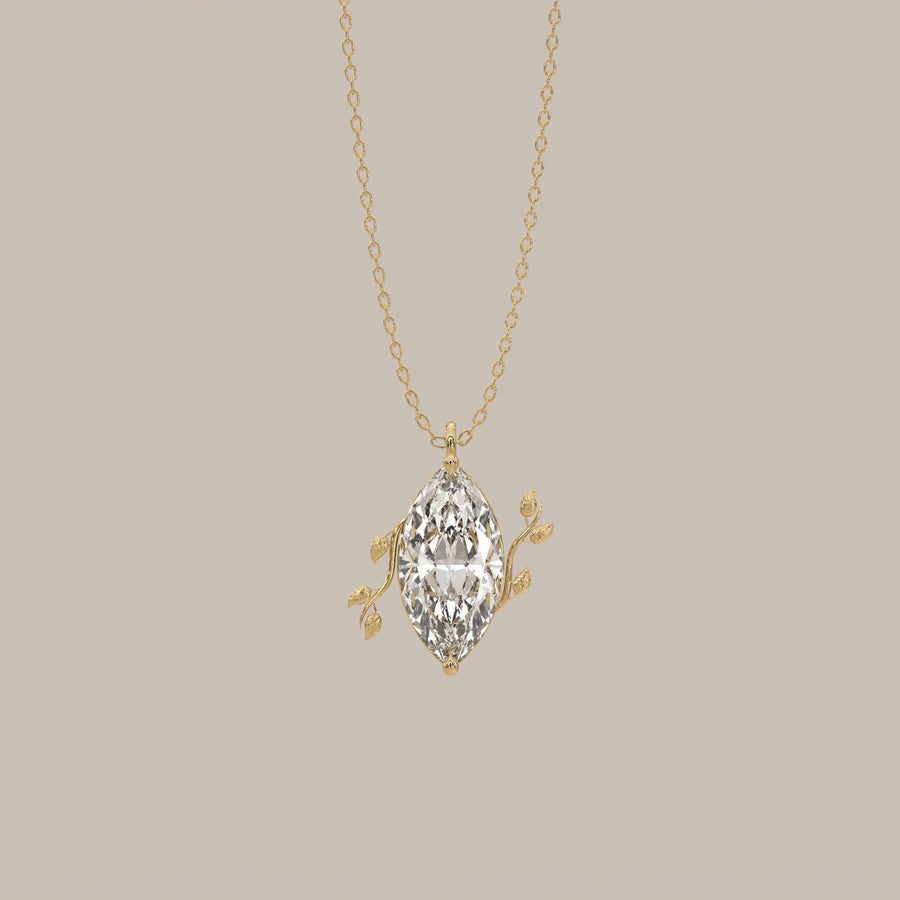 Marquise Lab Grown Diamond Solitaire Pendant with Twin Leaf Vines in yellow gold, shown from the front.