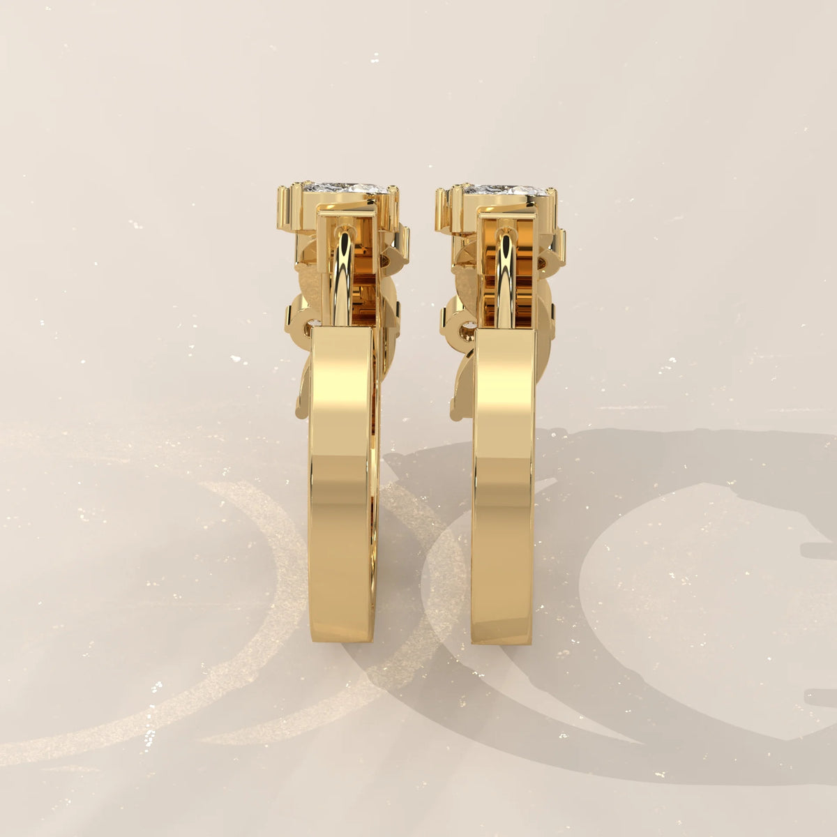 Marquise and Round Lab Grown Diamond Hoops in a Leaf Pattern in yellow gold, shown from the side.
