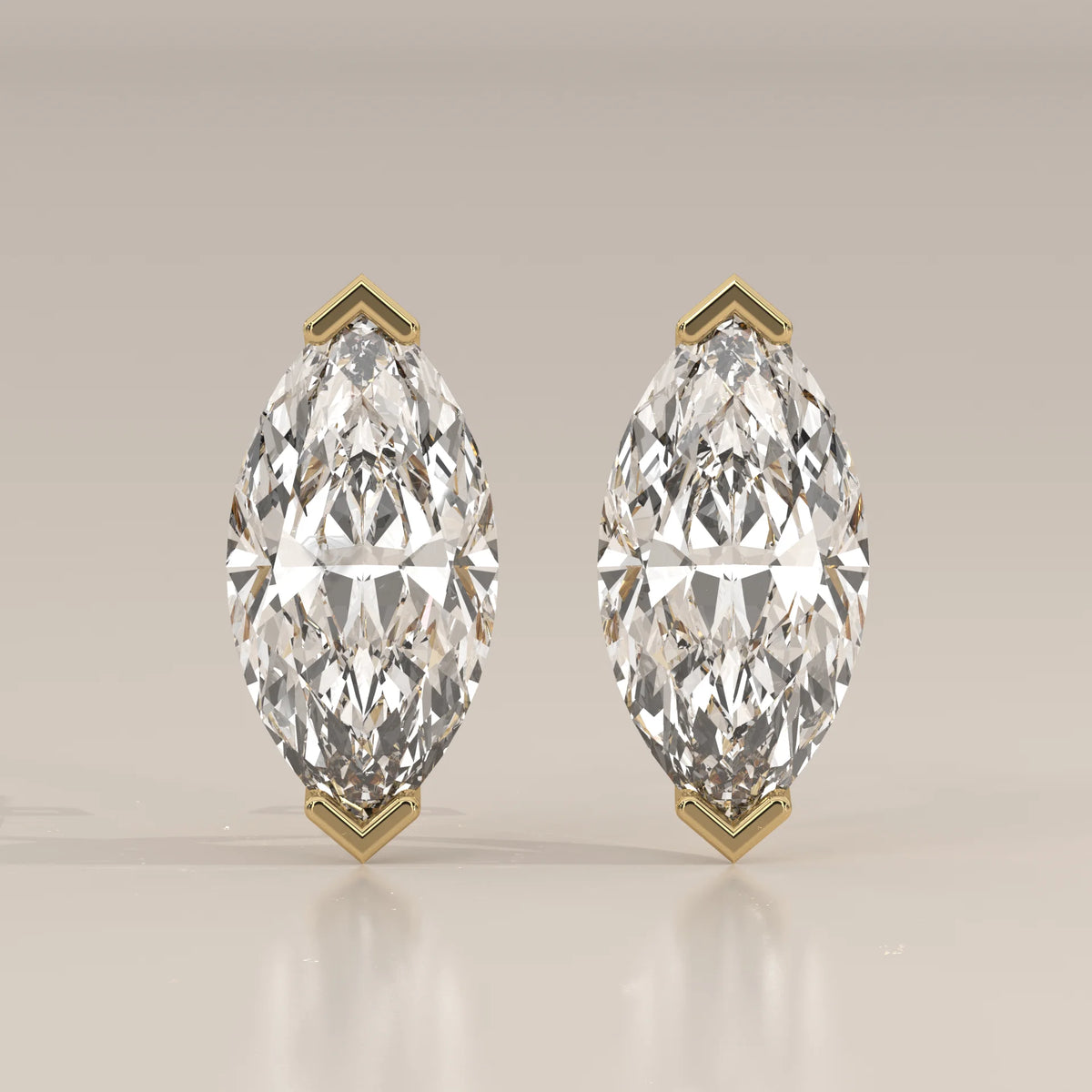 Marquise Solitaire Lab Grown Diamond Studs with V Tip Prongs in yellow gold, shown from the front.