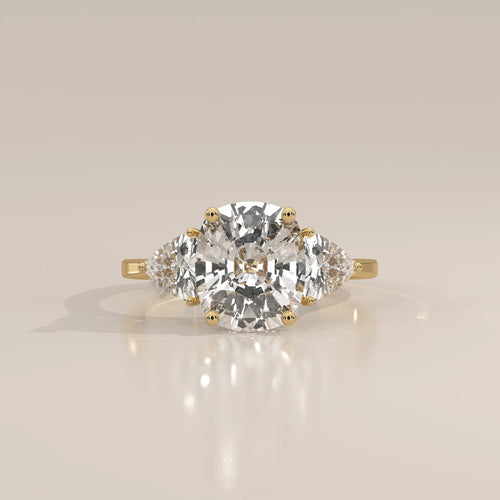 Mennie 5 Carat Cushion Lab Grown Diamond Ring, Trillion Sides in yellow gold, photographed head-on.