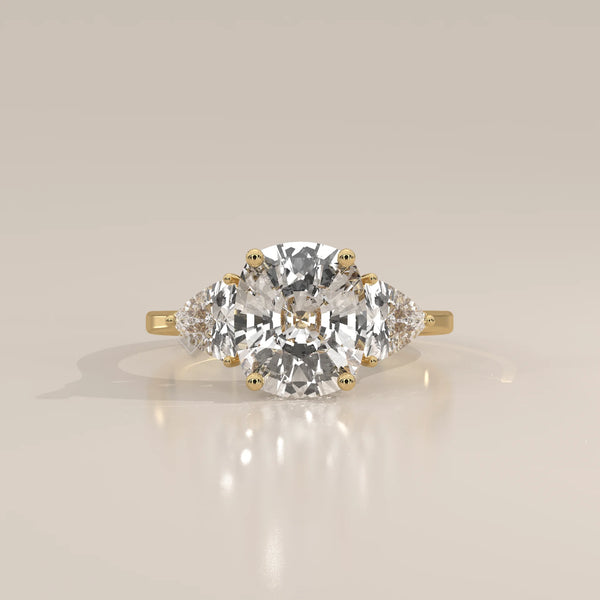 Mennie 5 Carat Cushion Lab Grown Diamond Ring, Trillion Sides in yellow gold, photographed head-on.