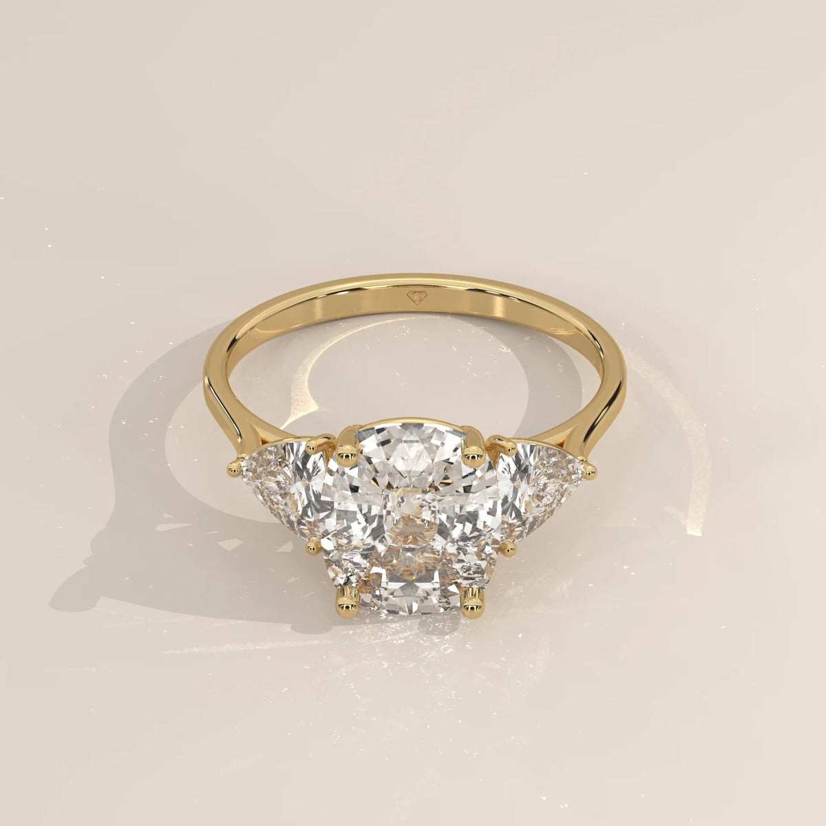 Mennie 5 Carat Cushion Lab Grown Diamond Ring, Trillion Sides in yellow gold, shown from the front.