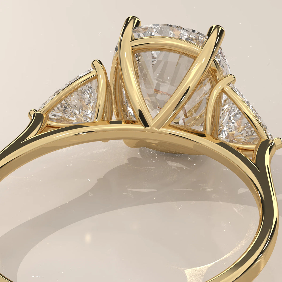 Mennie 5 Carat Cushion Lab Grown Diamond Ring, Trillion Sides in yellow gold, photographed from the side.