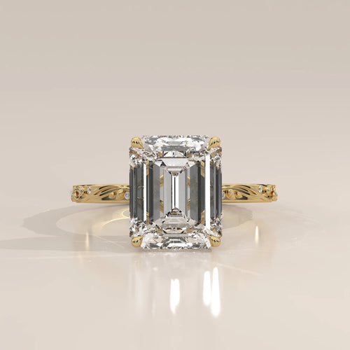 Miloise 5 Carat Emerald Cut Lab Grown Diamond Ring, Engraved Vine in yellow gold, shown from the front.