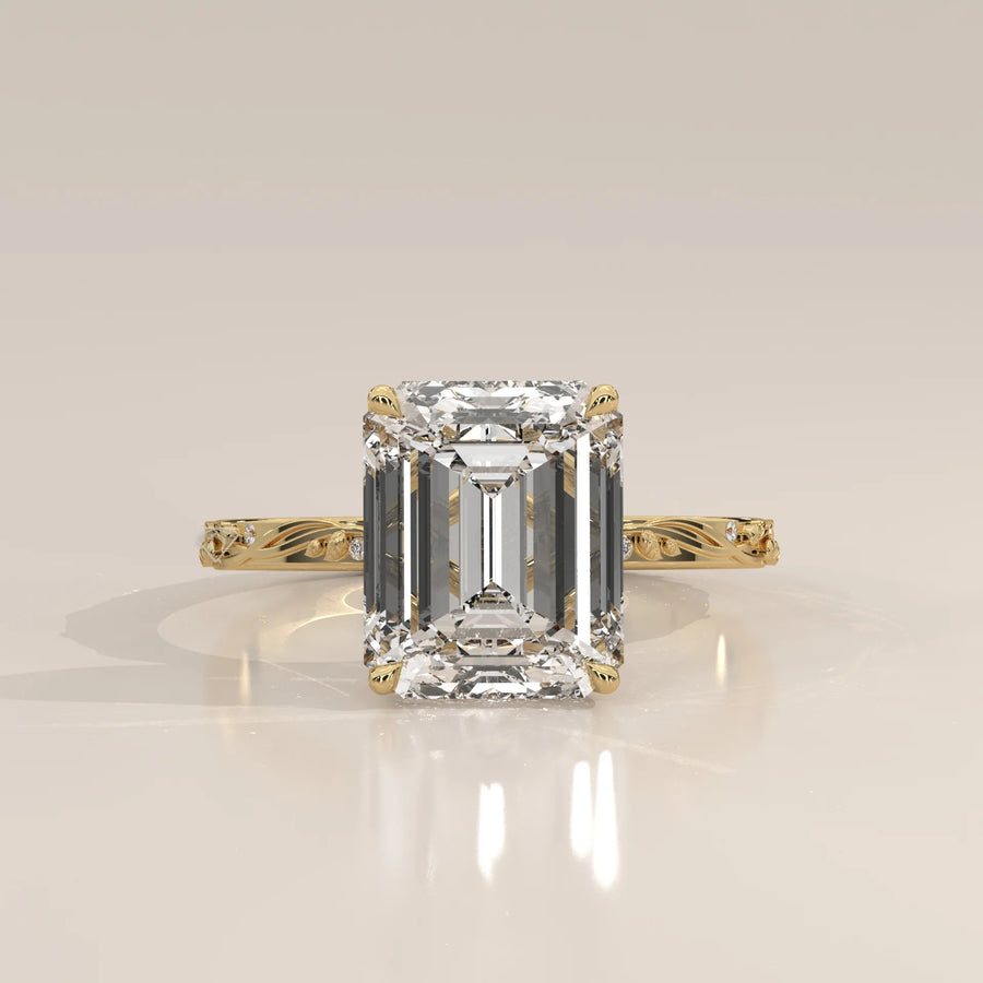 Miloise 5 Carat Emerald Cut Lab Grown Diamond Ring, Engraved Vine in yellow gold, shown from the front.