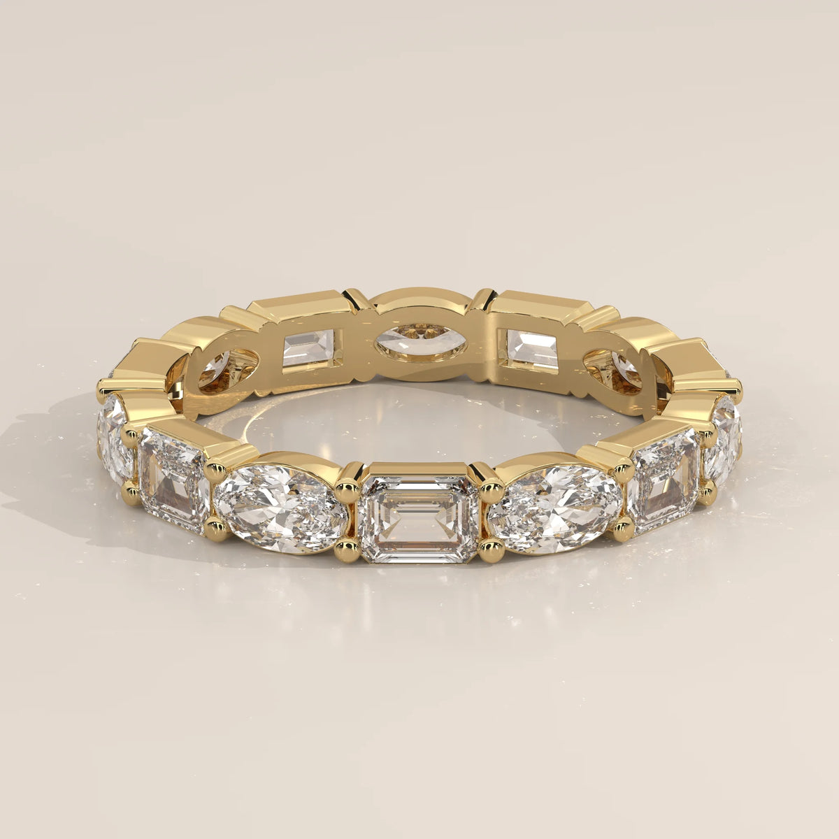 Three-Quarter View: Emerald Cut Diamond Eternity Band with Eternity Setting in Yellow Gold – Lab Grown – Driona Jewels
