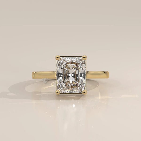 Nachel 5 Carat Radiant Lab Grown Diamond Solitaire Ring, Plain Band in yellow gold, photographed head-on.